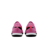 Rear view of two pink Nike Mercurial soccer shoes with red and black accents and white midsoles on a black background.