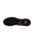 Sole view of a pink Nike indoor soccer shoe with a textured black rubber outsole and a white swoosh logo.