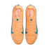 Top-down view of bright orange Nike soccer cleats with blue swoosh accents and Kylian Mbappé "KM" branding on the insoles.