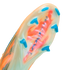 Close-up of a translucent soccer cleat soleplate with orange and green patterns, bright blue bladed studs, and "AIR ZOOM" text.