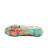 Bottom of a Nike soccer cleat featuring a translucent soleplate with orange swirls, blue "AIR ZOOM" branding, and blue studs against a black background.