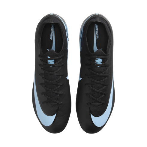 Top-down view of a pair of black Nike Mercurial soccer cleats featuring light blue accents and large swooshes on the toes, set against a black background.