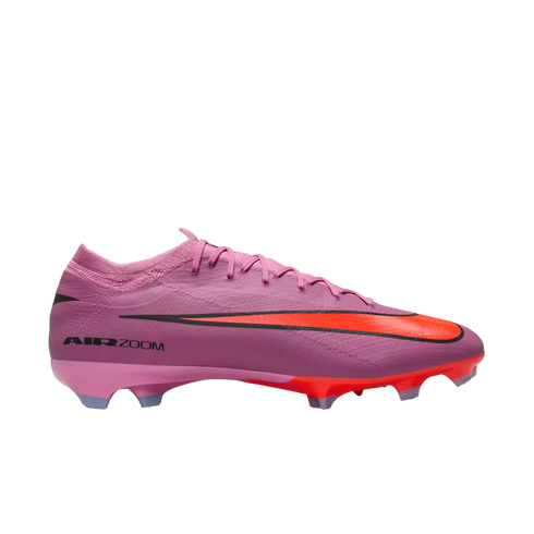 Profile view of a pink Nike Air Zoom Mercurial Vapor 15 soccer cleat featuring a bright orange Swoosh logo against a black background.