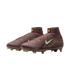 A pair of maroon Nike Mercurial Superfly football boots with pale green swooshes and high-top collars featuring KM AIR branding, shown against a black background.