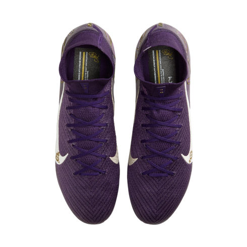 Top-down view of purple Nike soccer cleats with white swooshes and gold accents on a white background.