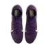 Top-down view of purple Nike soccer cleats with white swooshes and gold accents on a white background.