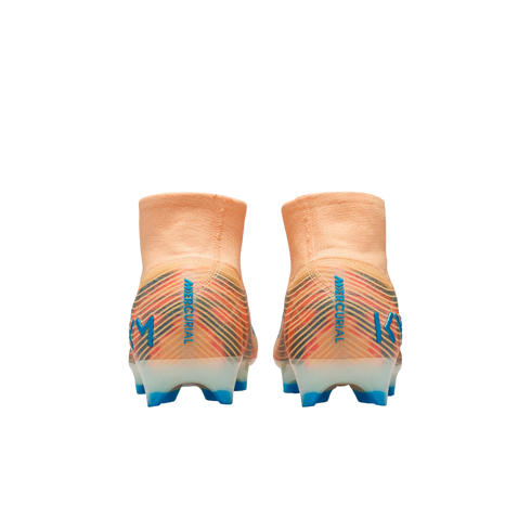 Back view of two orange Nike Mercurial soccer cleats with blue "KM" logos and colorful striped heels against a black background.
