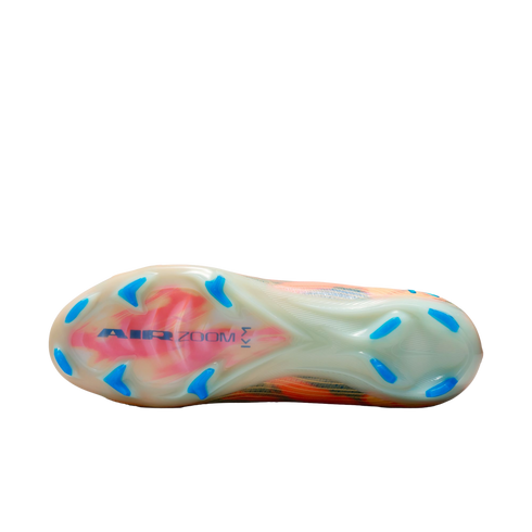Bottom view of a Nike soccer cleat featuring a translucent soleplate with blue studs and "AIR ZOOM" branding on a black background.