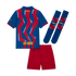 Back view of an FC Barcelona soccer kit featuring a blue jersey with red zig-zag patterns, solid red shorts, and matching blue and red socks.