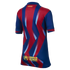 Back view of an FC Barcelona jersey with red and blue zigzag stripes, a small Catalan flag on the collar, and the UNHCR ACNUR logo at the bottom.