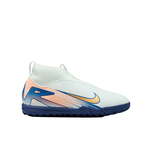 A pale green Nike turf soccer shoe featuring a gold swoosh, orange and blue graphics, a high-top sock-like collar, and a dark blue textured sole.