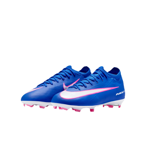 A pair of royal blue Nike Air Zoom soccer cleats with white swooshes and pink accents, isolated on a black background.