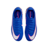 Top-down view of a pair of bright blue Nike Mercurial soccer cleats with large white swooshes outlined in pink, isolated on a black background.