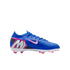 Blue Nike soccer cleat with pink and white accents, a large "M" logo on the heel, and pink studs against a black background.