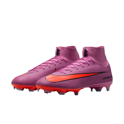 Vibrant pink Nike Mercurial soccer cleats with a bright orange swoosh and orange studs, set against a solid black background.