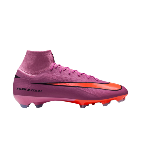Pink and orange Nike Air Zoom soccer cleat with a high-top collar, shown in profile against a solid black background.