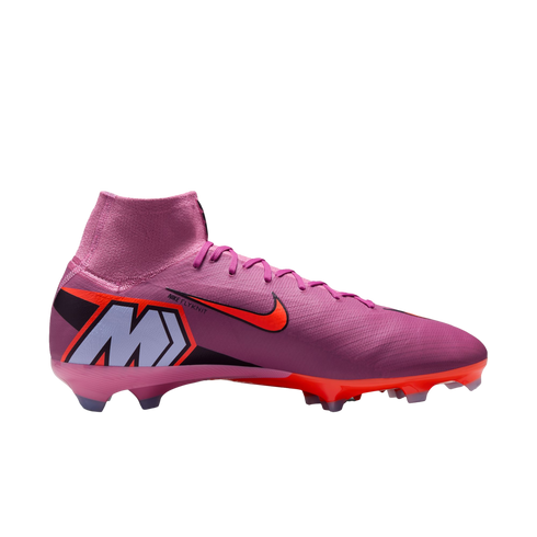A pink Nike high-top soccer cleat with orange accents and a large "M" logo on the heel, shown in profile against a solid black background.