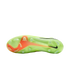 Soleplate of a lime green Nike soccer cleat featuring molded studs, a bright orange design on the forefoot, and a black swoosh near the heel.