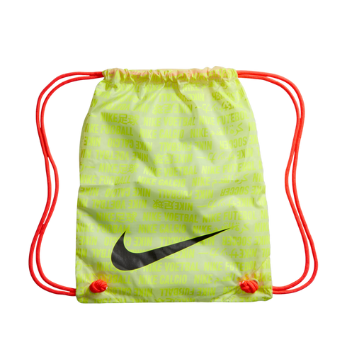 Lime green Nike drawstring bag with orange cords, a black swoosh, and a repeating multilingual soccer print on a black background.