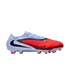 Profile view of a Nike soccer cleat with a light blue heel and a vibrant red, textured forefoot. Features a black swoosh and red studs against a black background.