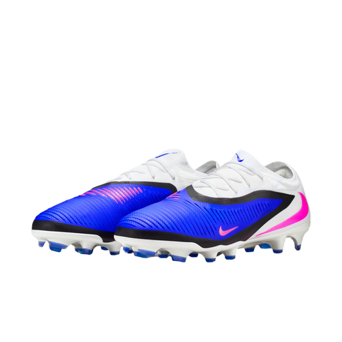 A pair of Nike soccer cleats with a white upper, vibrant blue body, and pink Nike swoosh logos set against a black background.
