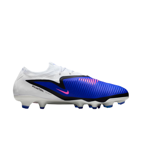 Side profile of a Nike Phantom Venom soccer cleat. The shoe features a white and blue Flyknit upper with pink accents on the swoosh and textured strike zone.