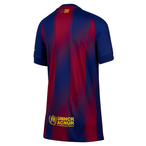 Back view of a blue and maroon striped soccer jersey with gradient effects, featuring a small flag at the neck and a yellow UNHCR ACNUR logo at the bottom.