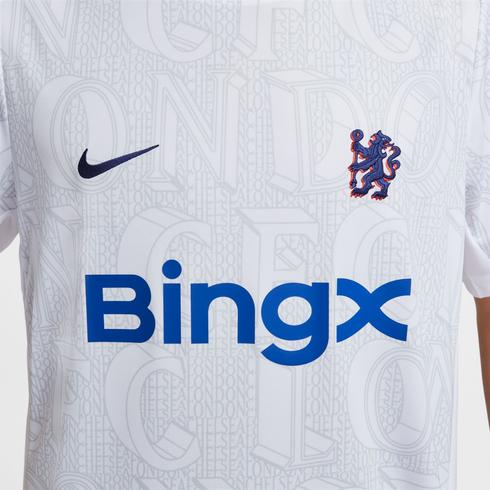 Close-up of a white Chelsea FC football jersey featuring a Nike swoosh, the team's lion crest, and a large blue BingX sponsor logo.