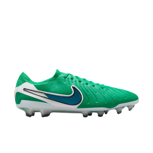 Side profile of a green Nike Tiempo soccer cleat with white details, a teal Nike swoosh, and a studded sole against a white background.