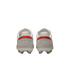 Rear view of two white soccer cleats with red heel accents and embossed "HIKE" branding against a black background.