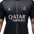 A black Jordan brand PSG soccer jersey with a white Jumpman logo, team crest, "QATAR AIRWAYS" logo, and a thin red vertical stripe down the center.