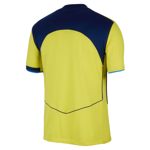 Back view of a yellow short-sleeved jersey with a navy blue upper panel, blue sleeve trim, and a thin V-shaped line near the hem. Set against a black background.