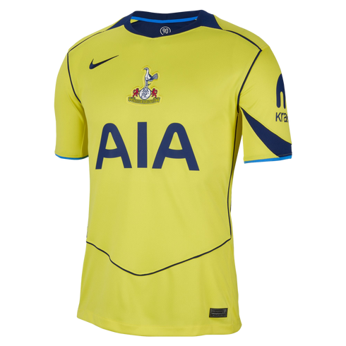 Bright yellow Nike Tottenham Hotspur football jersey with navy blue trim, featuring a centered club crest, AIA sponsor logo, and Kraken branding on the sleeve.