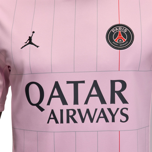 Close-up of a light pink PSG soccer jersey with vertical pinstripes, the Jordan logo, club crest, and "QATAR AIRWAYS" sponsor name.