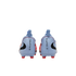 Rear view of light blue Nike Phantom soccer cleats with red studs and black branding on a black background.