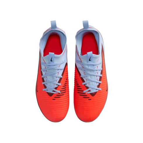 Top-down view of Nike soccer cleats with a bright orange forefoot, light blue laces and upper, and red interior, isolated on a black background.