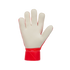 Palm view of a goalkeeper glove with cream-colored padding and a red wrist strap against a black background.