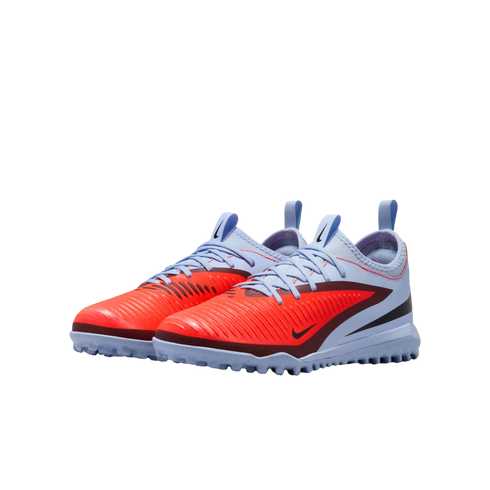 Pair of Nike turf soccer shoes in vibrant orange and light blue with black accents, shown against a solid black background.