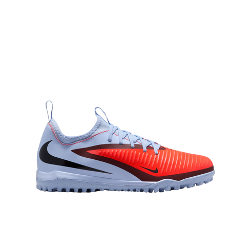 A light blue and bright orange Nike turf soccer shoe with a textured front, black swoosh, and speckled rubber sole.