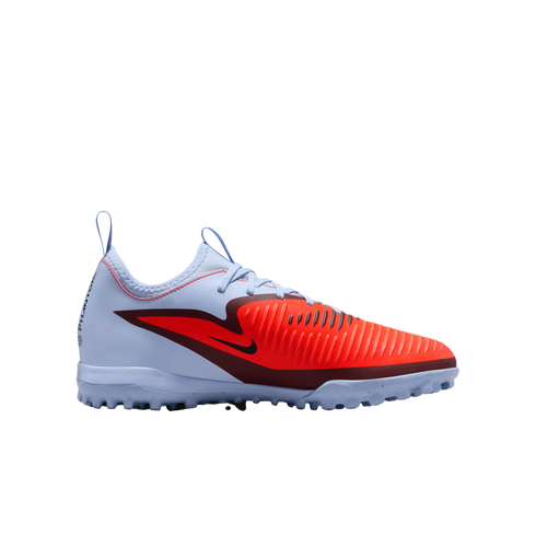 Side view of a light blue and bright orange Nike Phantom turf soccer shoe with a ribbed forefoot and dark red accents, shown against a solid black background.