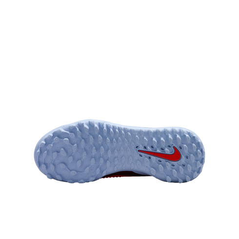 Sole of a light blue Nike sports shoe against a black background, showing a high-traction lug pattern and a red Nike swoosh logo on the heel.
