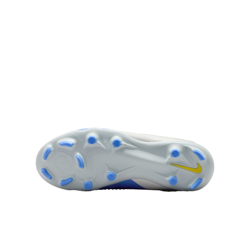 Bottom view of a white Nike soccer cleat with light blue studs and a yellow swoosh against a black background.