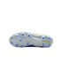 Bottom view of a white Nike soccer cleat with light blue studs and a yellow swoosh against a black background.