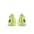 Rear view of neon yellow Nike Phantom soccer shoes with black logos, white midsoles, and lime green textured outsoles against a solid black background.