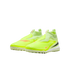 A pair of neon yellow, laceless Nike soccer turf shoes with orange and black swoosh accents on a solid black background.
