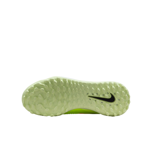 Bottom view of a light green Nike turf soccer shoe outsole with a black swoosh logo and textured traction nubs, isolated on a black background.
