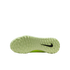 Bottom view of a light green Nike turf soccer shoe outsole with a black swoosh logo and textured traction nubs, isolated on a black background.