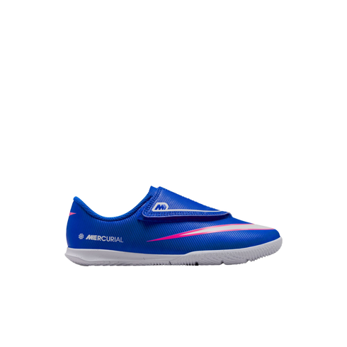 Blue Nike Mercurial soccer shoe for kids with a velcro strap and pink and white graphic detail on a white rubber sole.