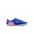 A profile view of a blue Nike Mercurial indoor soccer shoe with pink and white branding and a white flat sole, isolated on a black background.