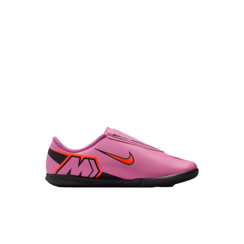 Pink Nike Mercurial indoor soccer shoe with an orange swoosh and black sole, shown in profile against a black background.